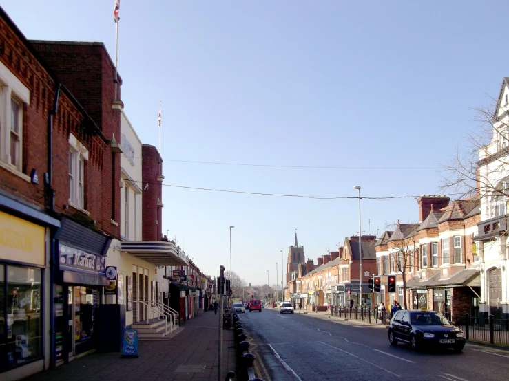 a large empty street is filled with cars