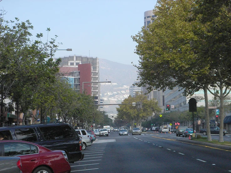 a city with many cars driving down it's street