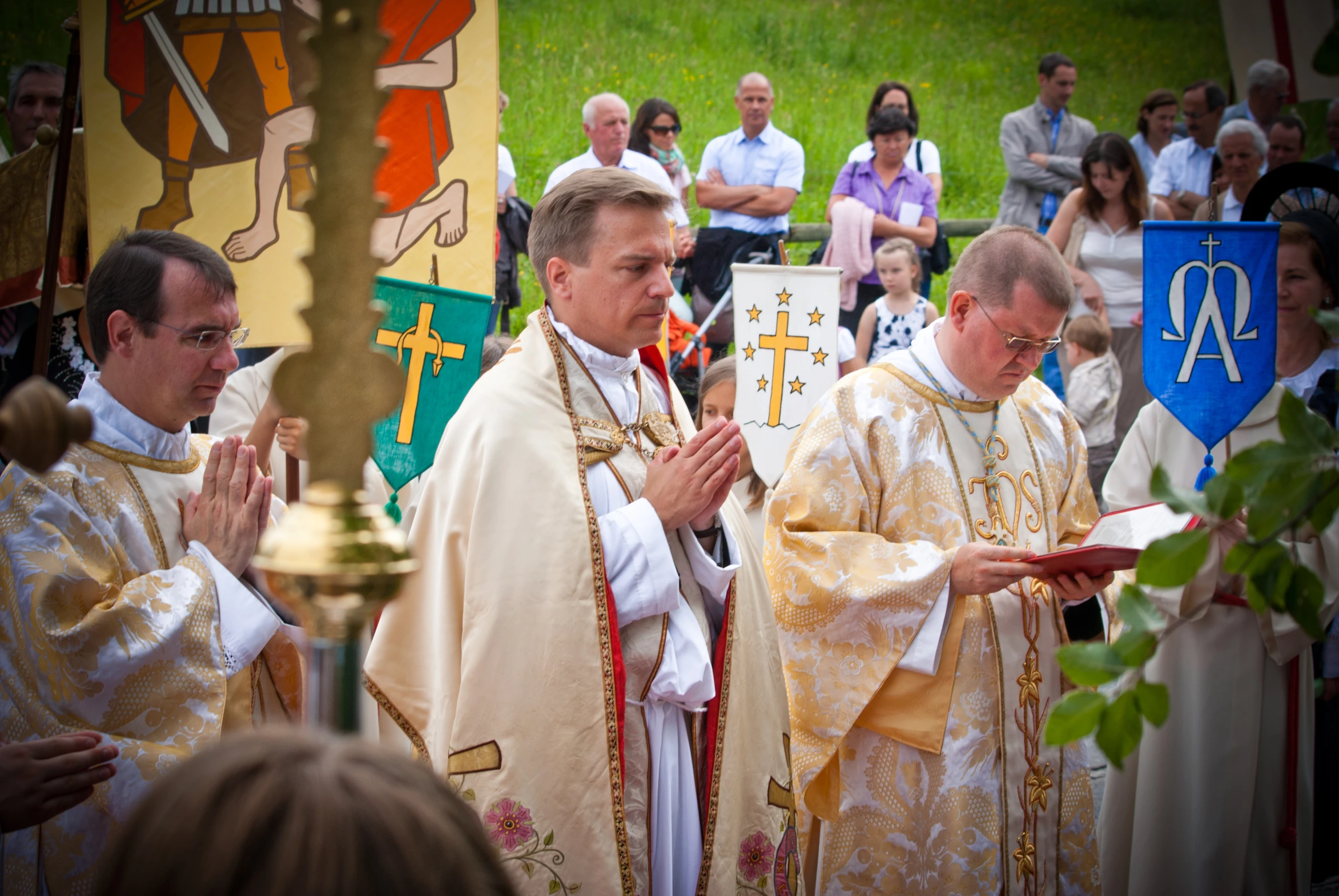 two priests stand at the alter and pray