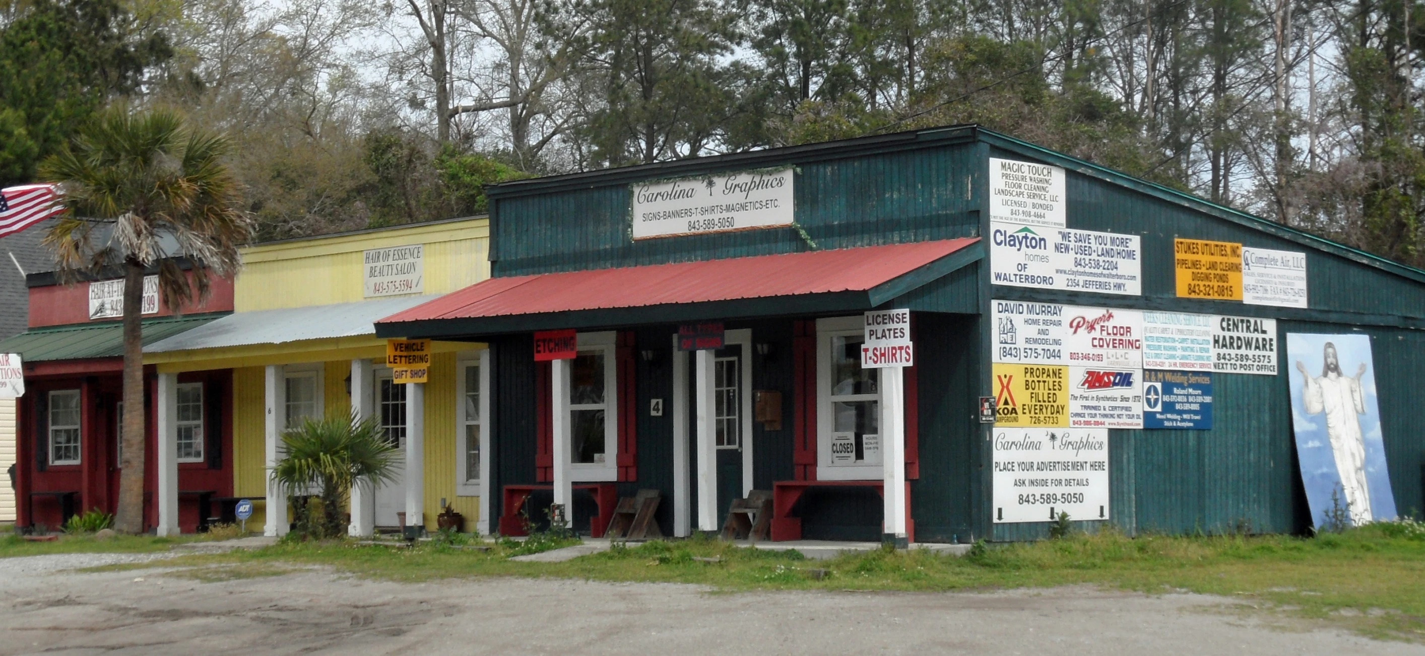 an old building with several signs on the side of it