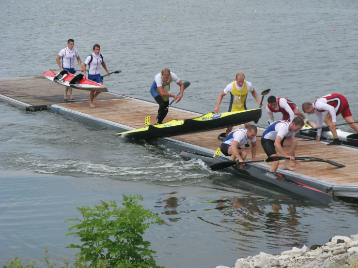 several rowers on their way to the start line