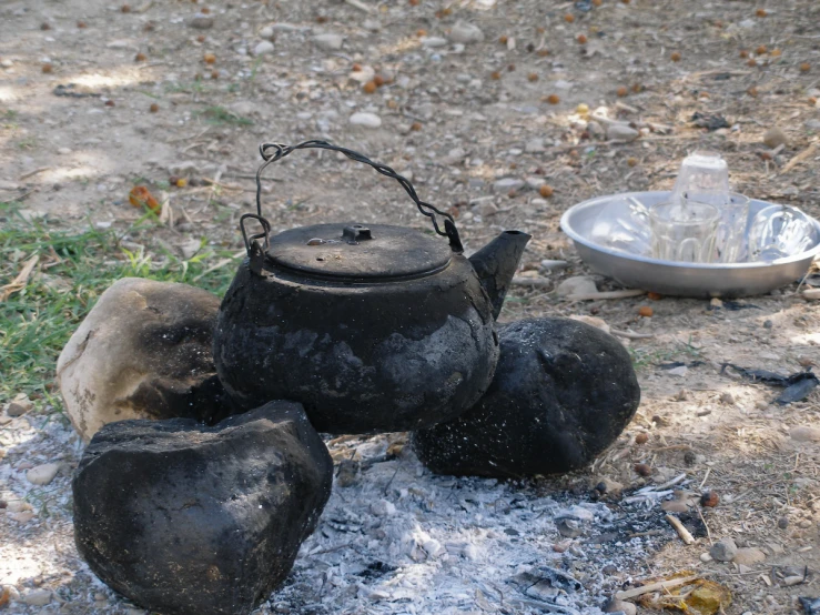 a group of teapots that are sitting on the ground