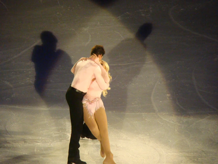 a pair performs an unusual, romantic ice dance