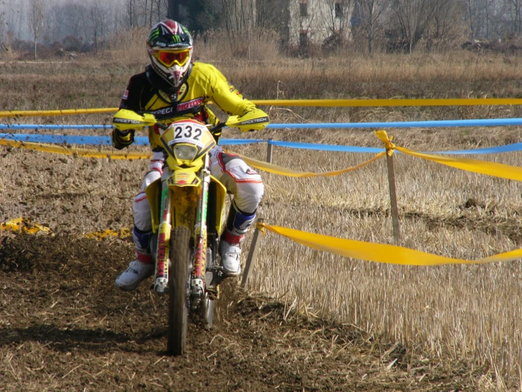 the rider is riding a dirt bike during a competition