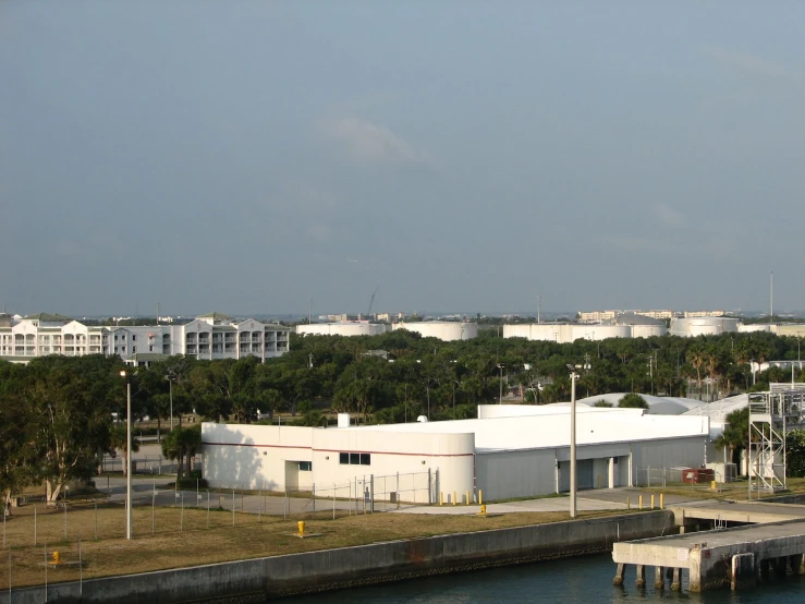 a view from an airplane, of some buildings along the water