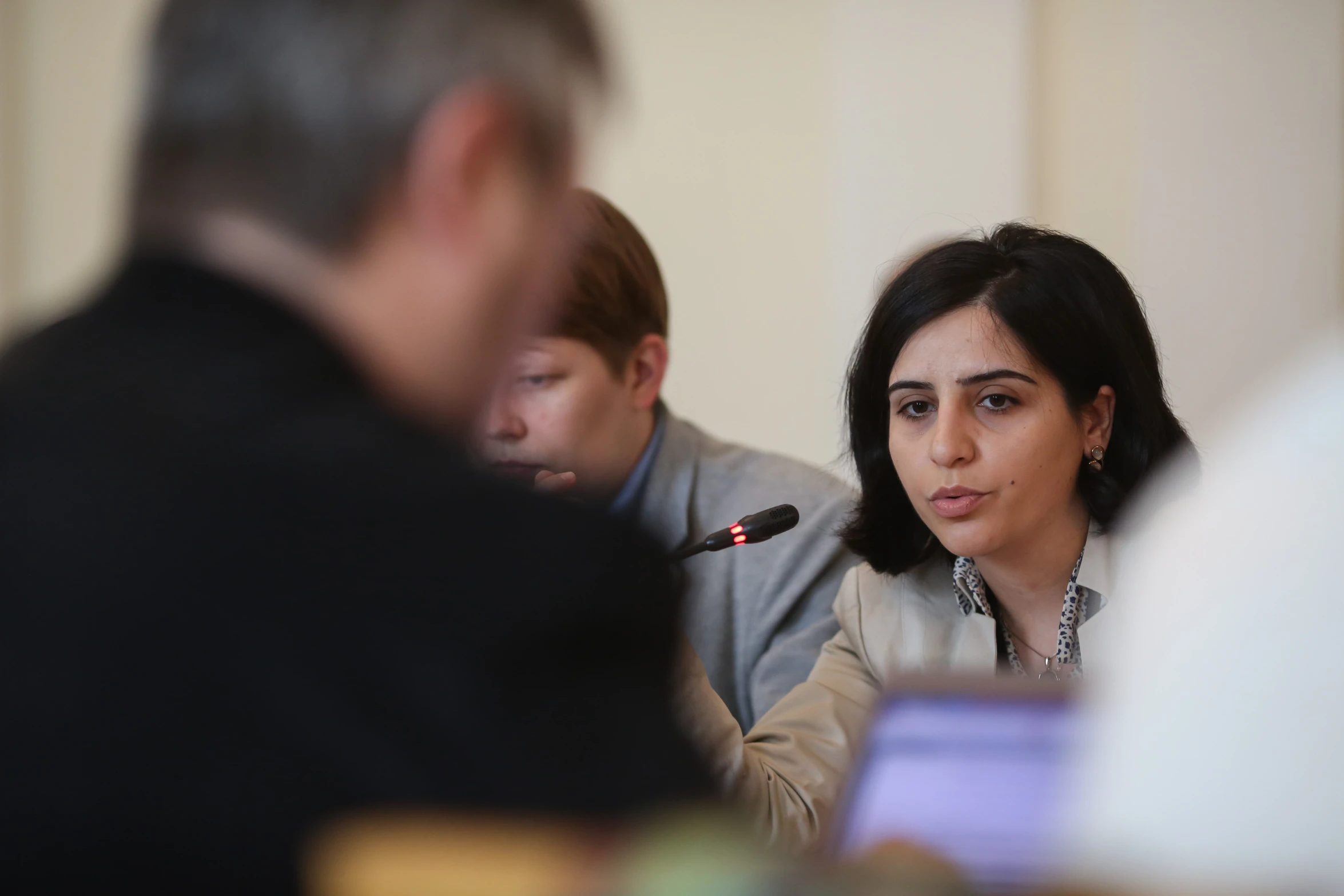 a woman talking with a man in front of her