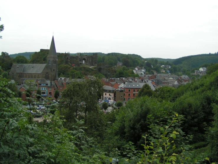 a view of a town and surrounding trees