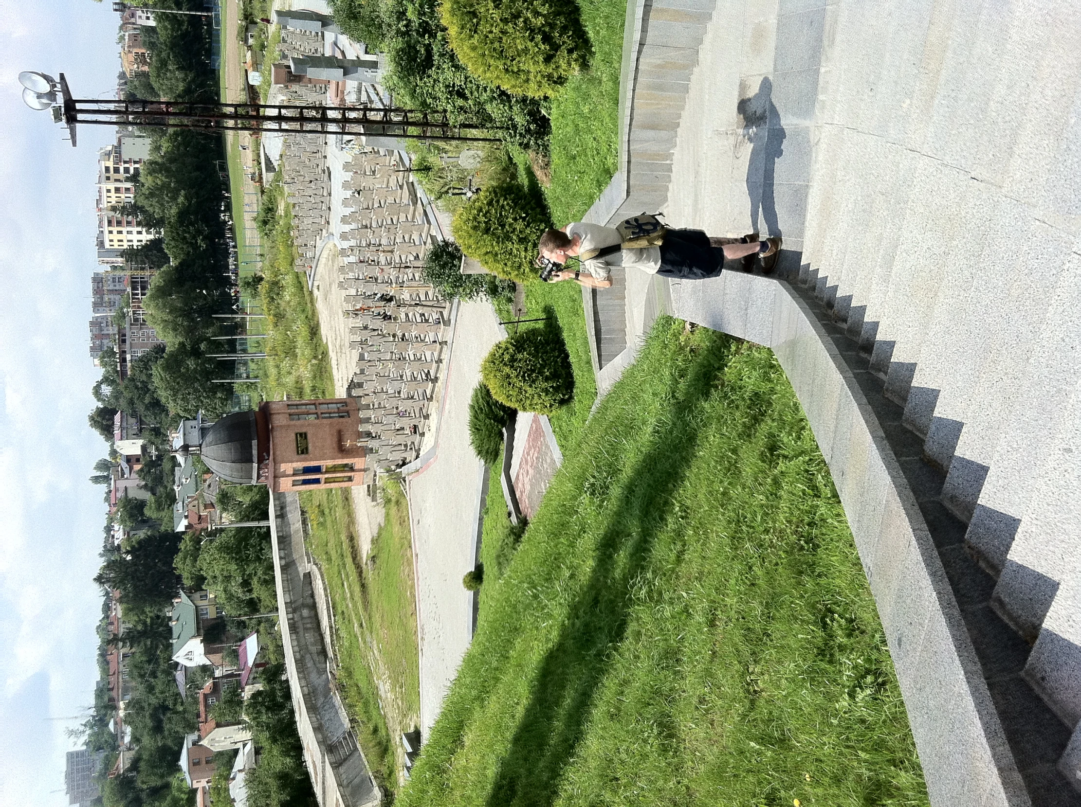 a person standing on a very long cement staircase