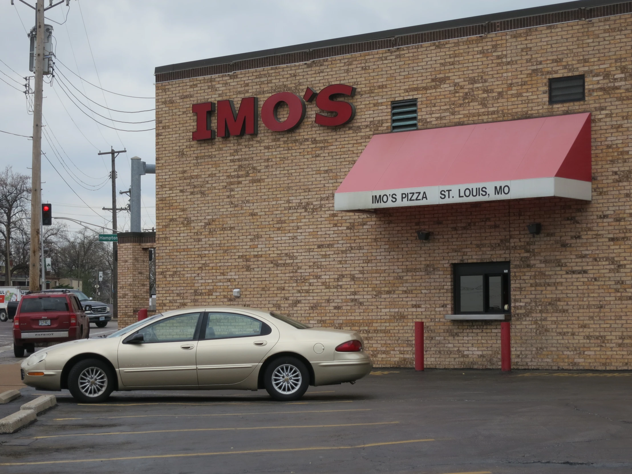 there is a car parked in the parking lot outside the timo's