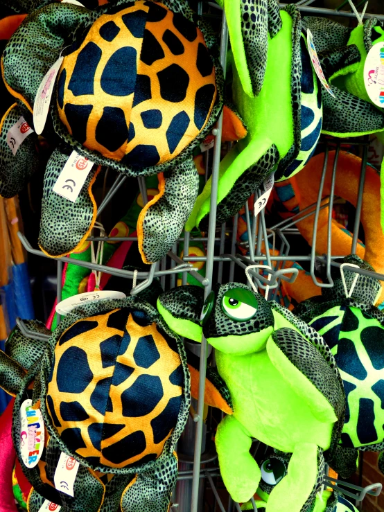 a large pile of stuffed animal in a wire basket