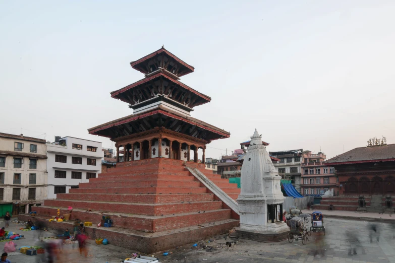 a tall tower sits in the middle of town