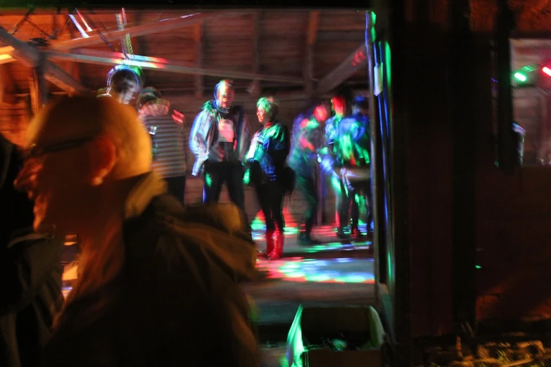 there are many people dancing on a large dance floor