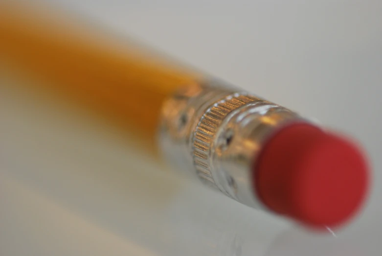 closeup of a pencil with a small orange tip