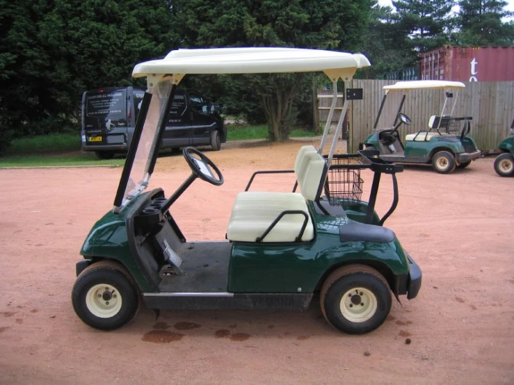 a green golf cart parked outside of a home