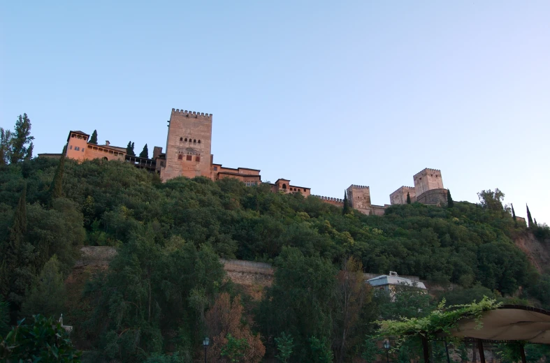 an ancient castle that is sitting on a mountain