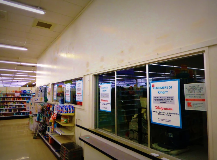 an empty grocery aisle and aisles with sign