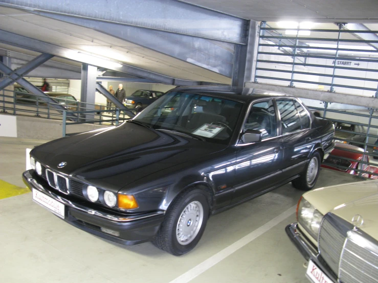 a black bmw is parked in the garage