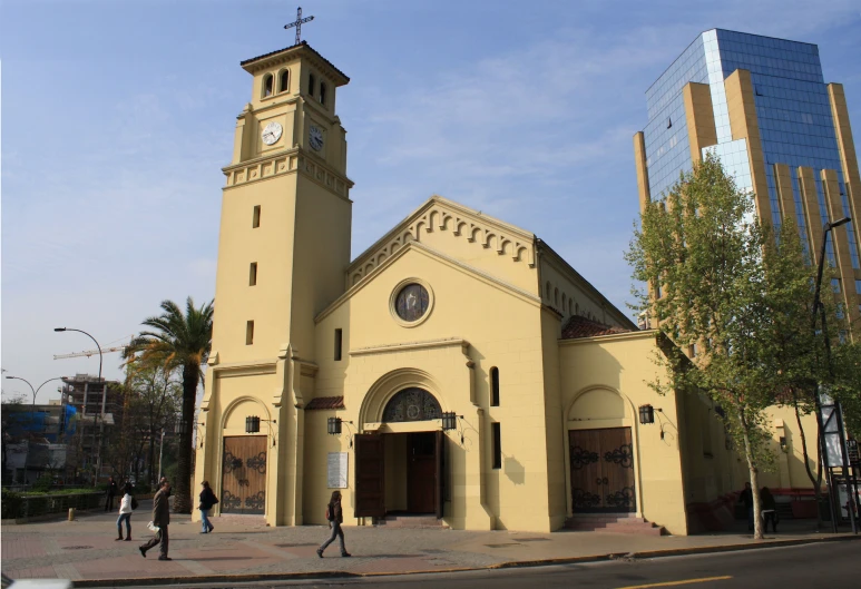 a church with a tall clock tower on the front