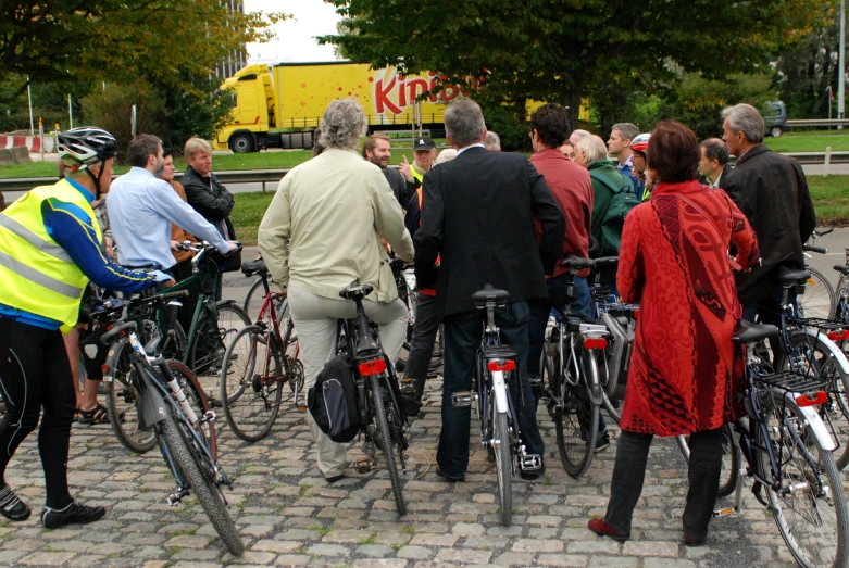 a crowd of bikers gather together at the start line