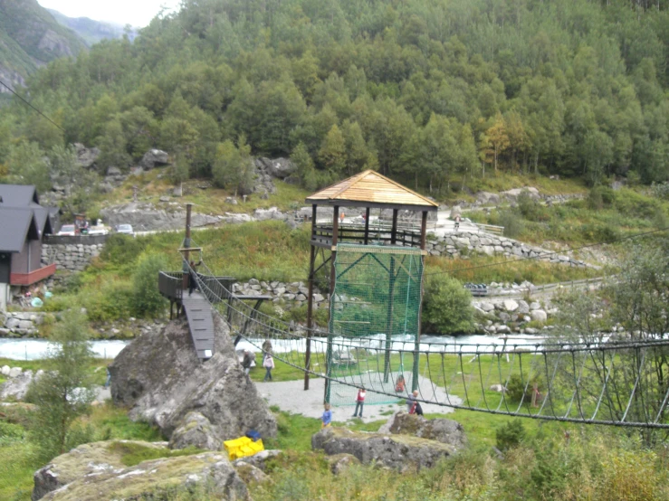 people enjoying the view of a suspension bridge