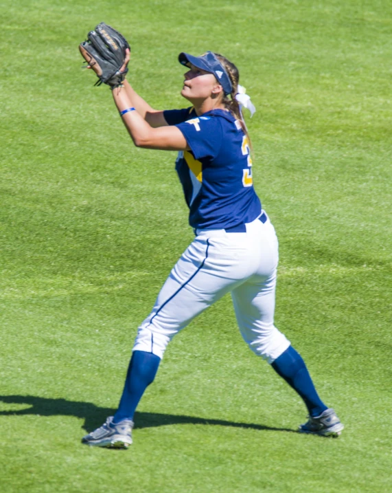 a woman throwing a ball in the air