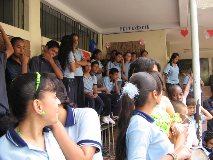 several students stand in front of a group of s