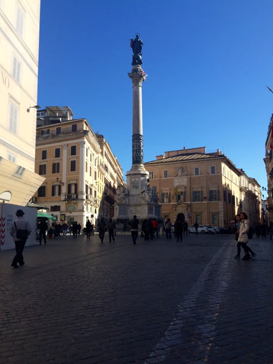 a city has many people walking around in the street