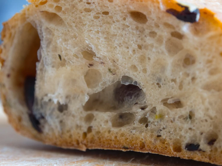 closeup of half of a loaf of bread that has been partially eaten