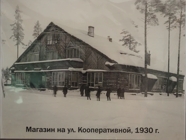 a group of people standing in front of a large house