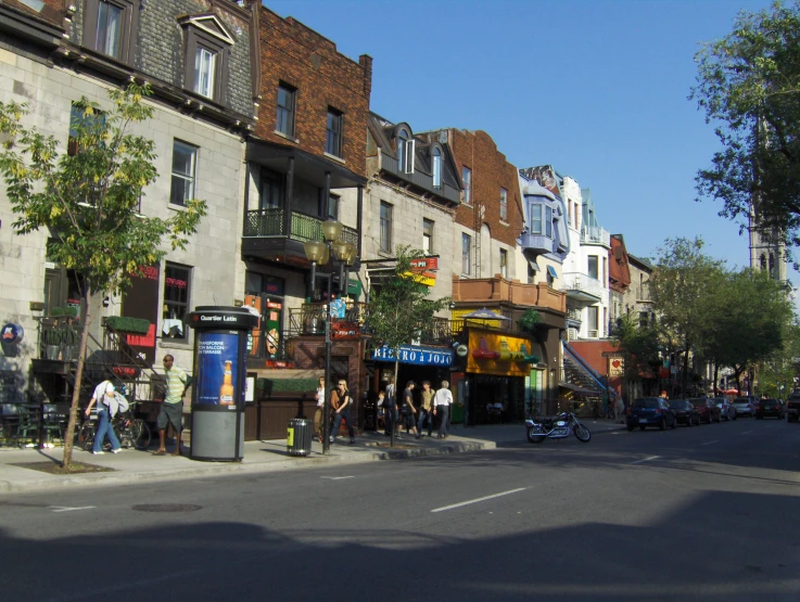 a city street filled with people and lots of buildings