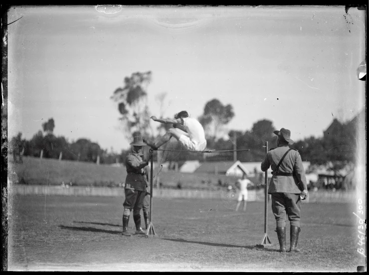 two men playing frisbee in an open field