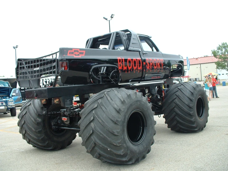 a large monster truck driving down a street