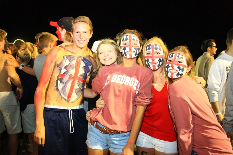 people in costume pose for the camera at a festival