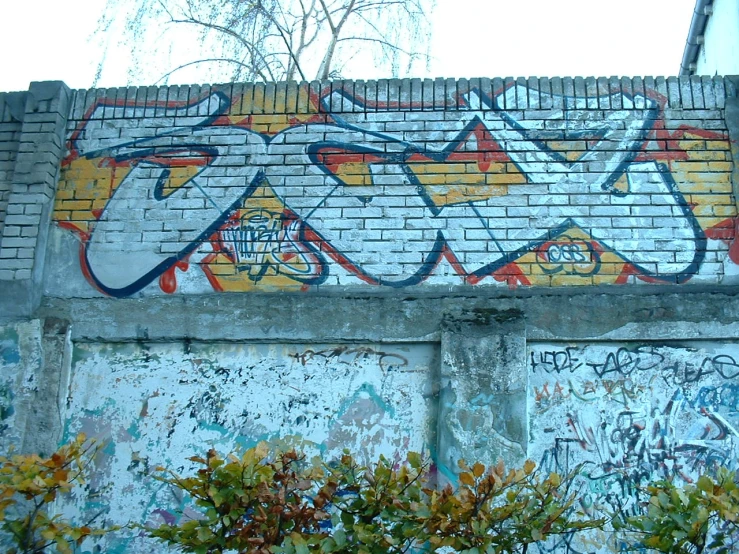 a graffiti wall with different colors on it