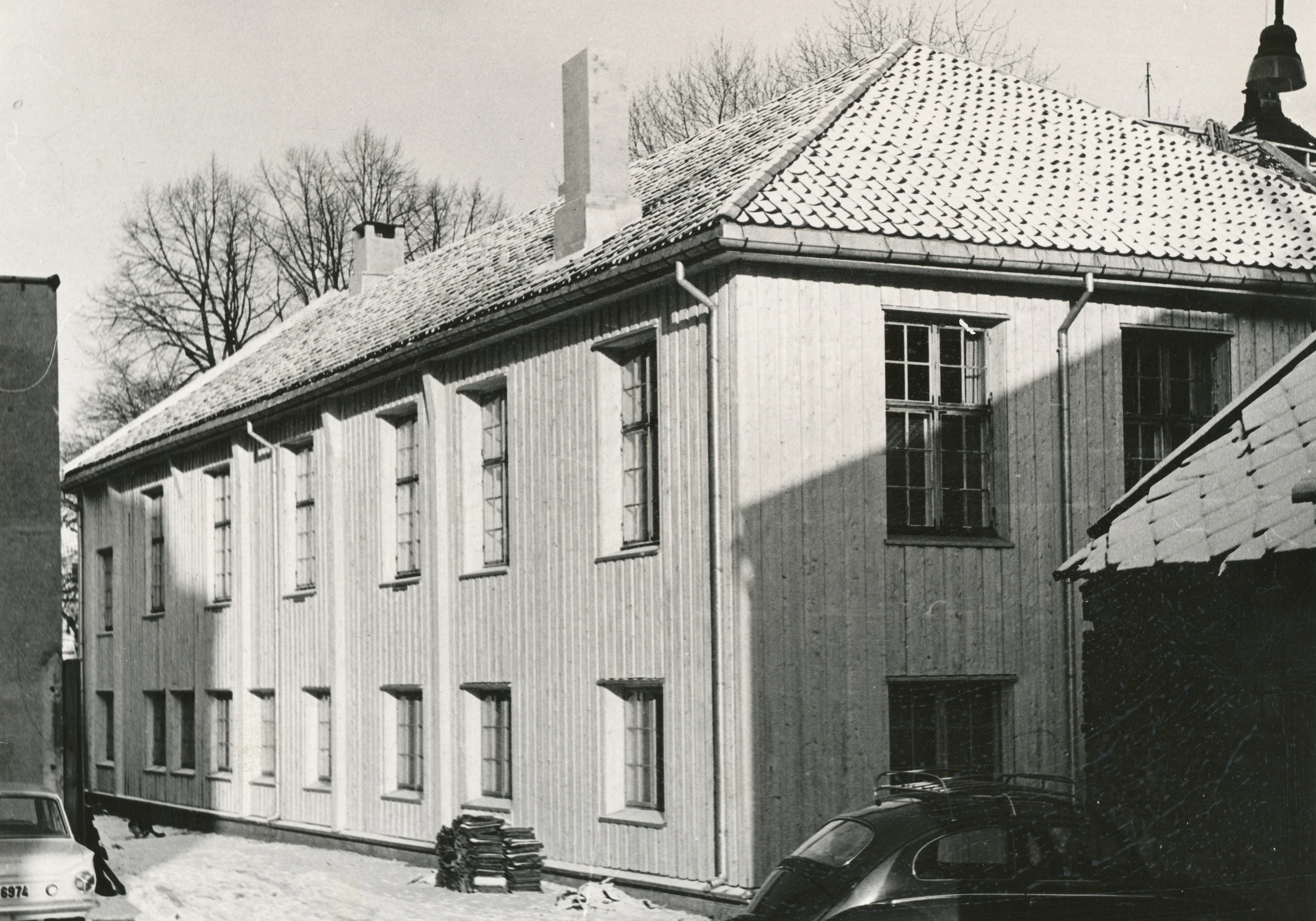 an old fashioned house with snow covered roofs