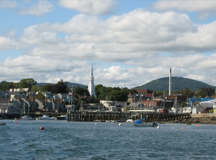 some boats are out in the water and buildings