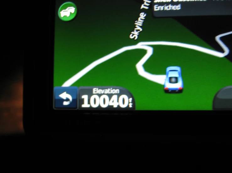 a gps device displaying a green car in it
