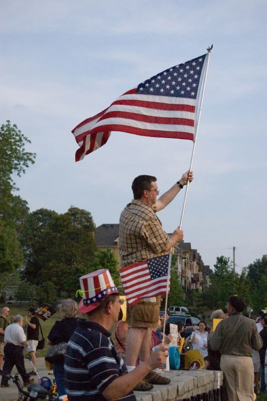 some people in hats and holding an american flag