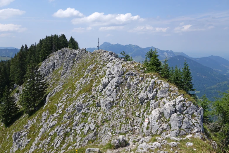 an area of rocky hills, trees, and rocks is pictured here