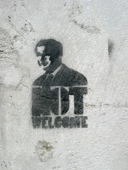 the stencil depicts a man wearing a suit with his mustache