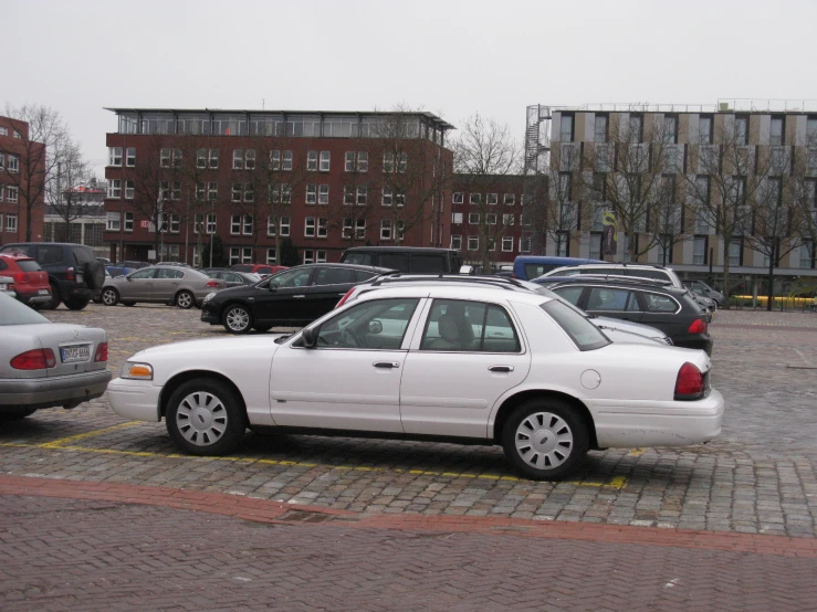 there is a white car parked in the lot