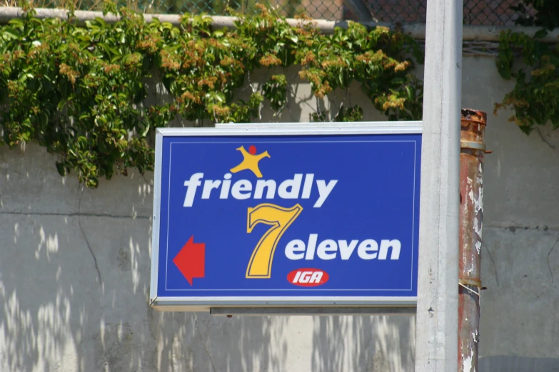 the neon blue and yellow sign for the 7 eleven is clearly visible