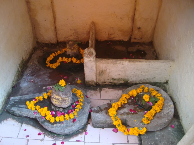 the inside of an old cement building decorated with flowers