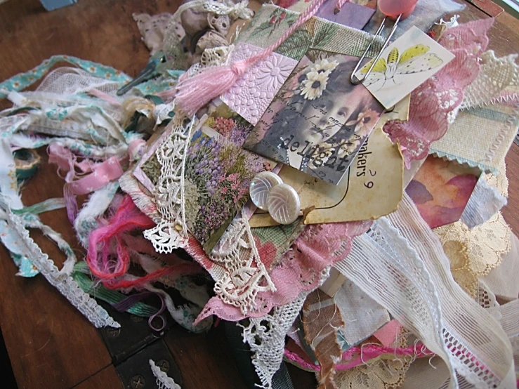 altered papers and papers are laying on top of a table