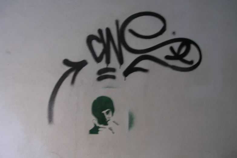 graffiti depicting a woman with long hair and an green background