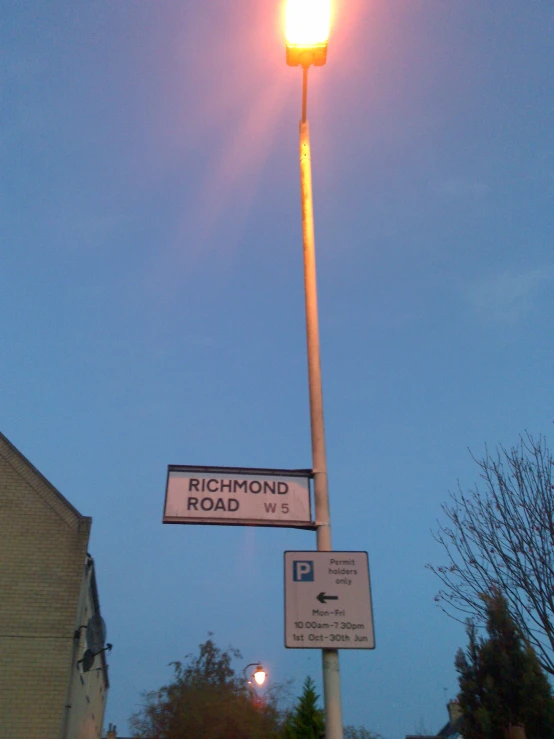 a street sign is pictured on a pole