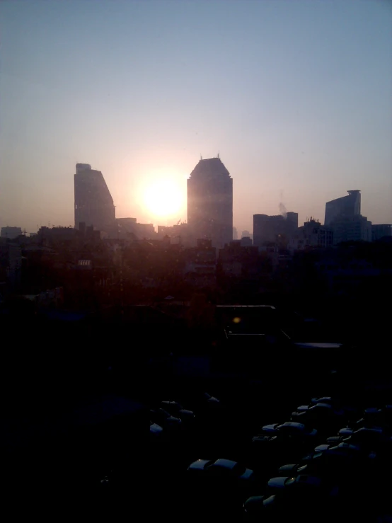 silhouettes of buildings and cars on the horizon of the city