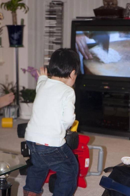 a little boy that is playing with the wii