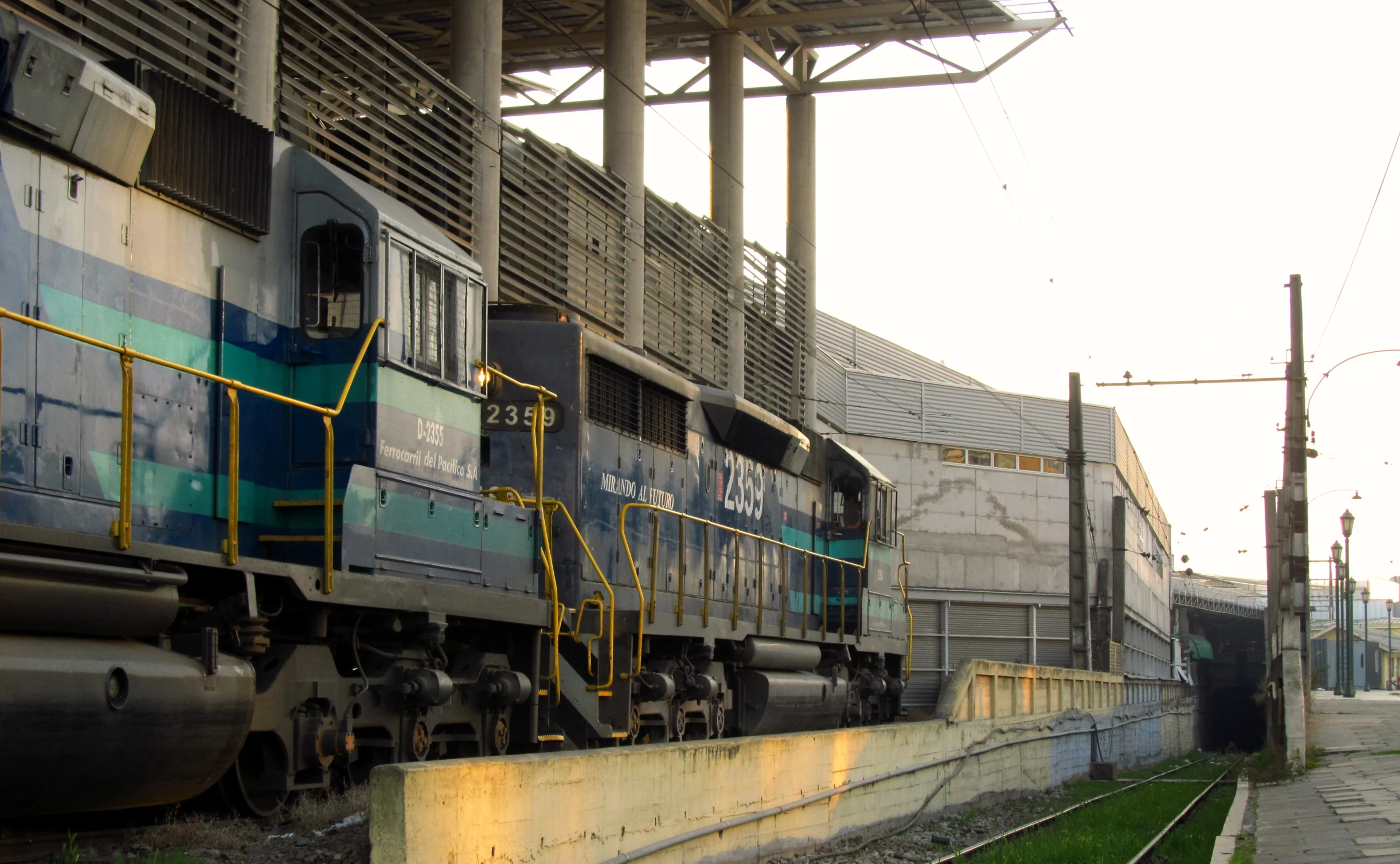 a train is parked at the station waiting to be loaded