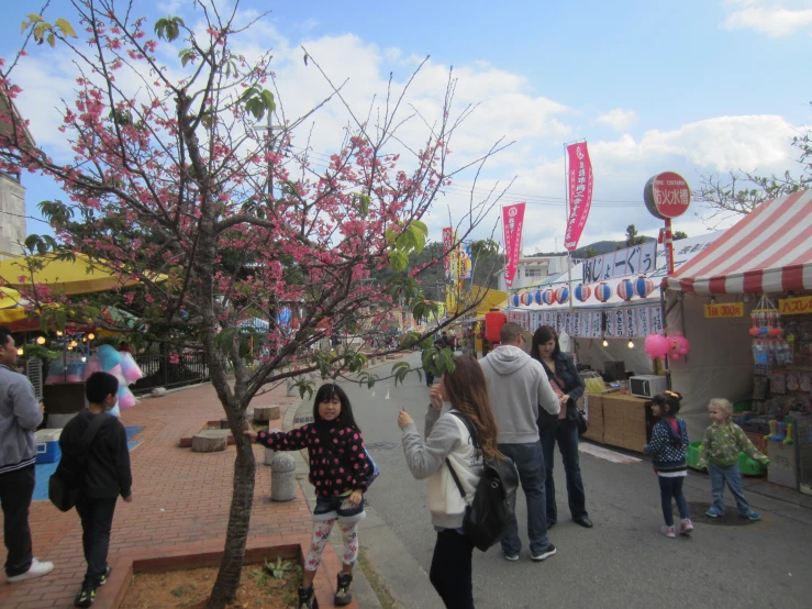 a group of people that are standing in the street